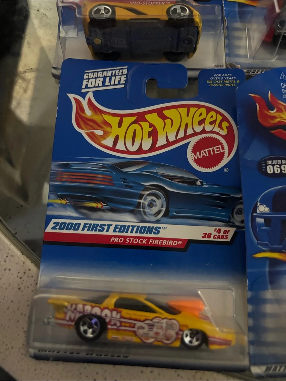 10 Hot Wheels cars in packaging